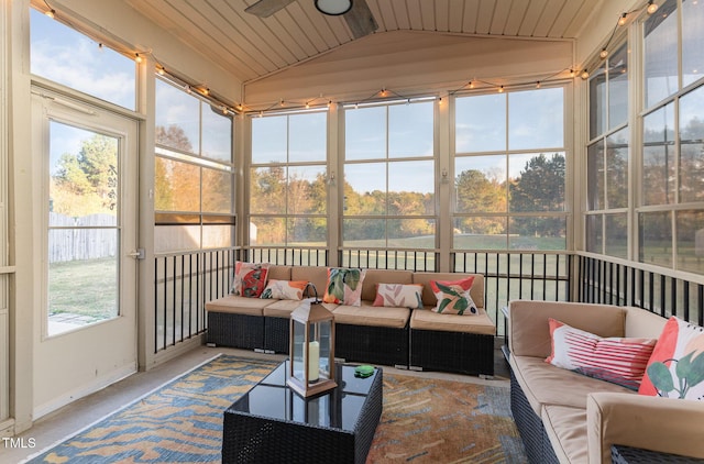 sunroom featuring lofted ceiling and wood ceiling