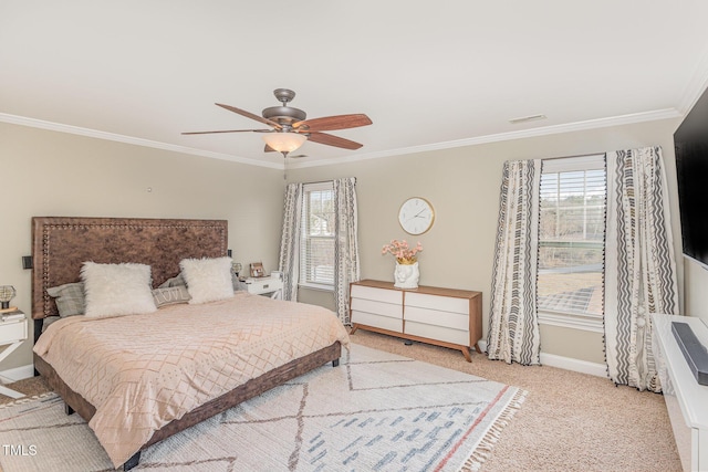 bedroom with crown molding, ceiling fan, and light carpet