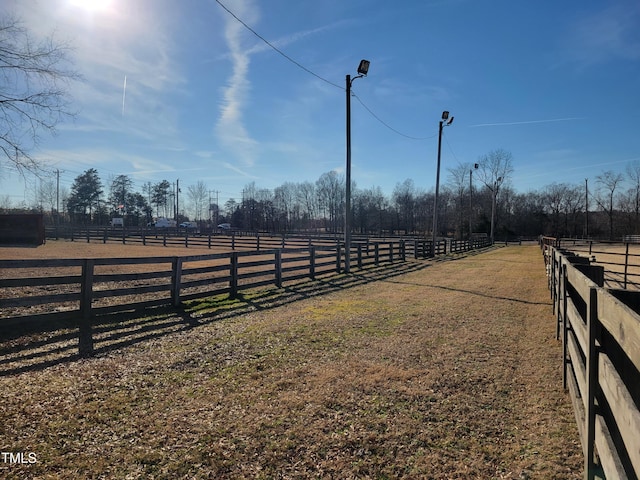 view of yard with a rural view