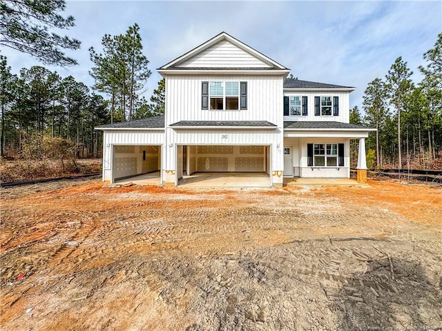 view of front of home with a garage and covered porch