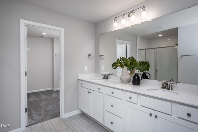 bathroom with vanity and an enclosed shower