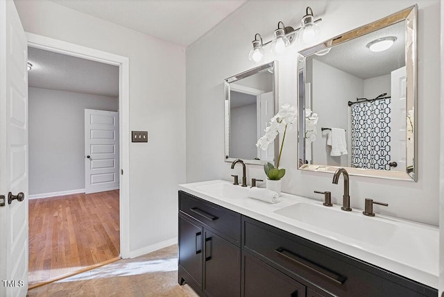 bathroom featuring vanity and hardwood / wood-style floors