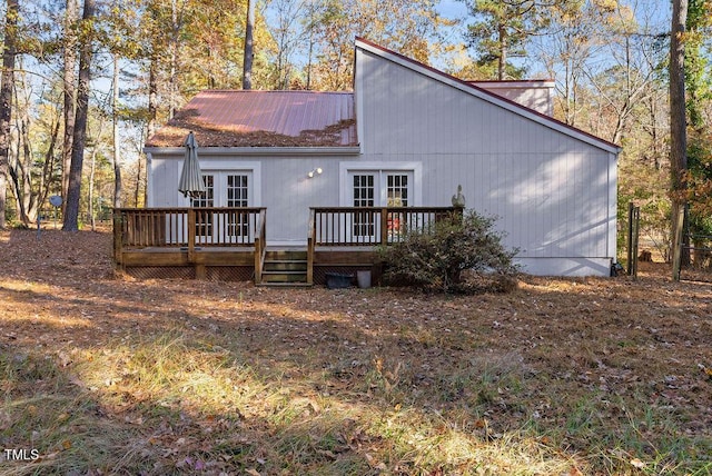 rear view of property with french doors and a deck