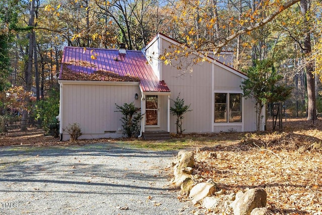 mid-century modern home with metal roof