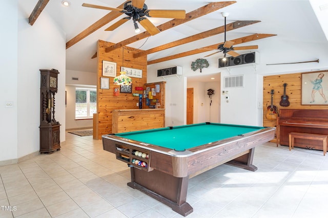 game room with beam ceiling, wooden walls, high vaulted ceiling, and ceiling fan