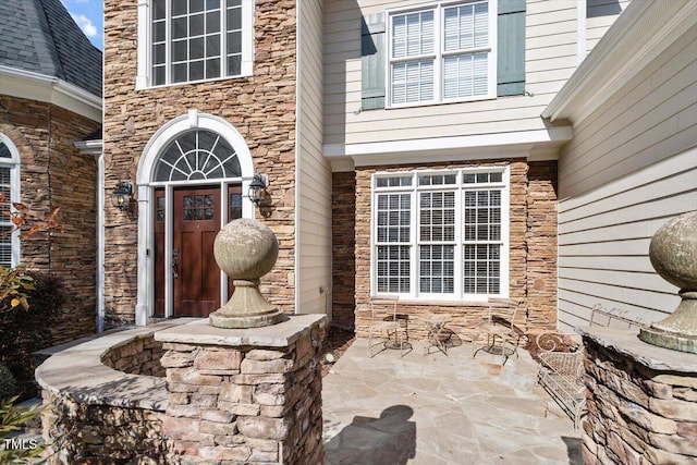 doorway to property with a patio