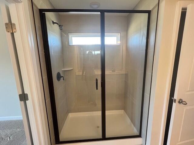 full bathroom with a stall shower