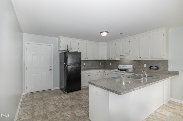 kitchen featuring electric stove, sink, white cabinetry, and black fridge