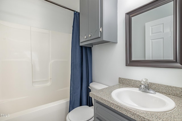 full bathroom with vanity, toilet, and shower / tub combo