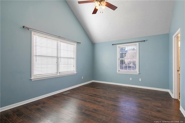 unfurnished room featuring ceiling fan, lofted ceiling, and dark hardwood / wood-style flooring