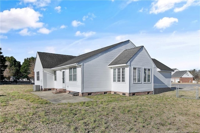 back of property with a patio and a lawn