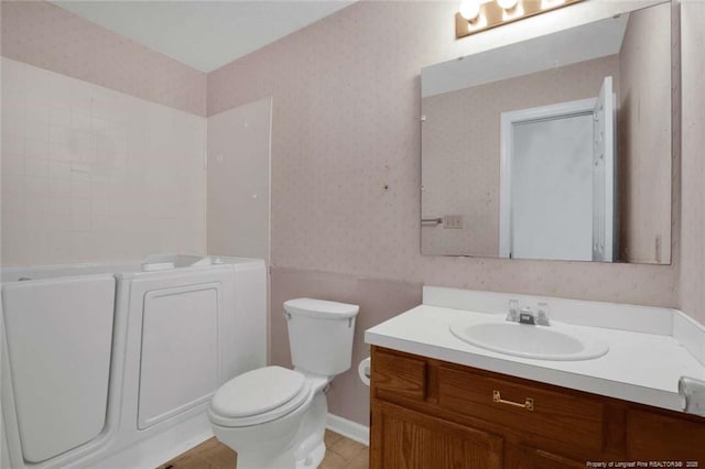 bathroom featuring vanity and toilet