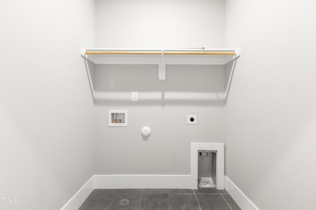 laundry area featuring washer hookup, hookup for a gas dryer, electric dryer hookup, and dark tile patterned floors