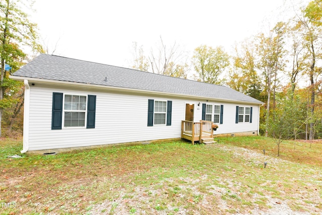 ranch-style home with crawl space, roof with shingles, and a front lawn