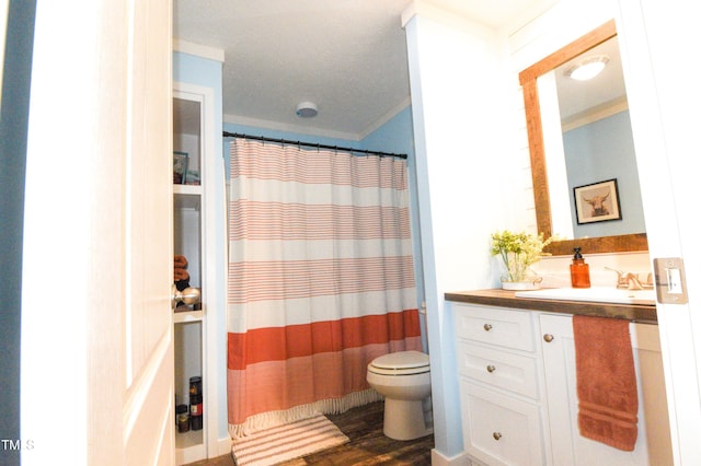 bathroom featuring vanity, toilet, curtained shower, and hardwood / wood-style floors