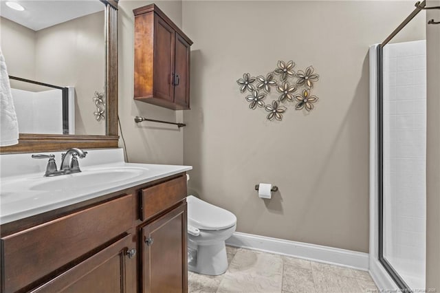 bathroom featuring vanity, toilet, and a shower with door