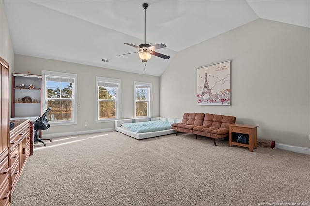 living room with lofted ceiling, carpet floors, and plenty of natural light