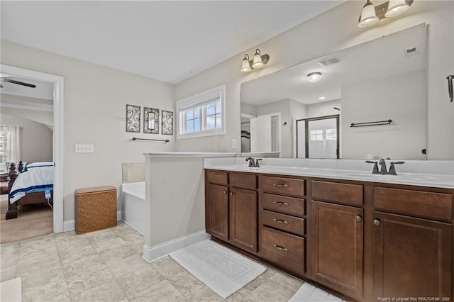 bathroom featuring vanity and separate shower and tub