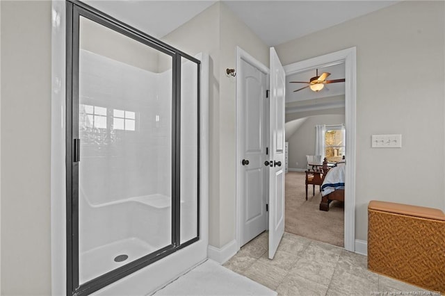 bathroom featuring a shower with shower door