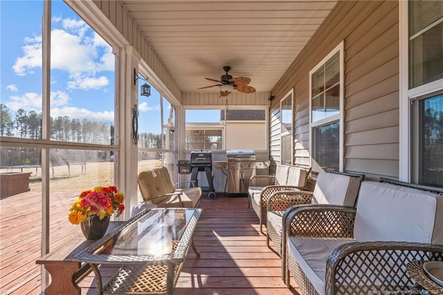 sunroom / solarium with ceiling fan