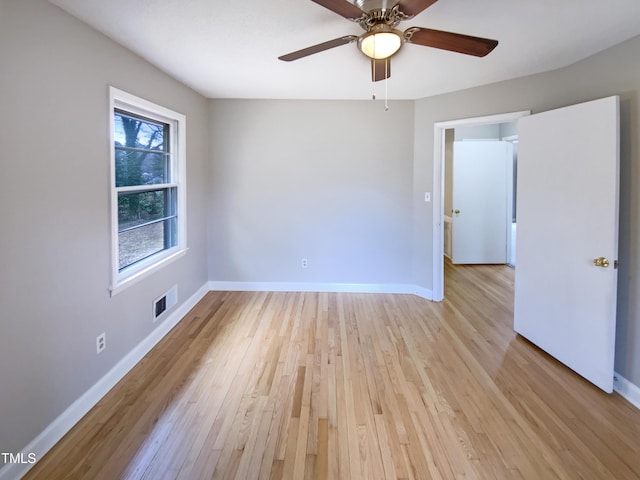 spare room with ceiling fan and light hardwood / wood-style flooring