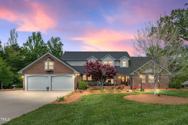 view of front facade featuring a garage and a lawn