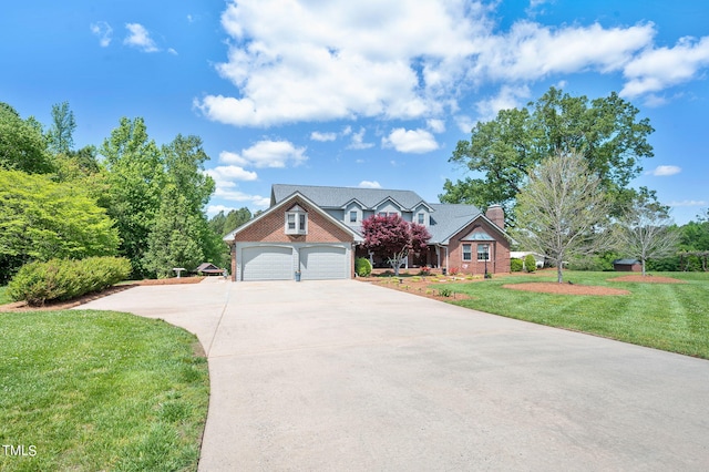 view of front of property featuring a garage and a front yard