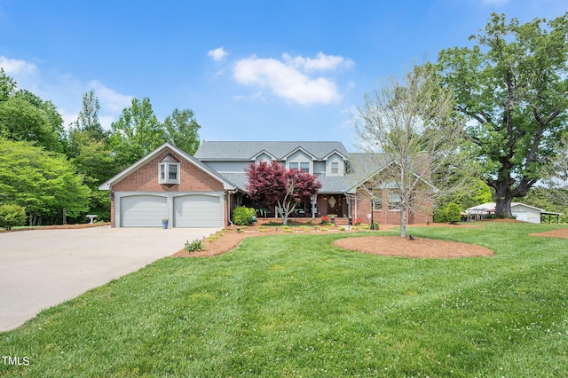 view of front of home with a garage and a front yard