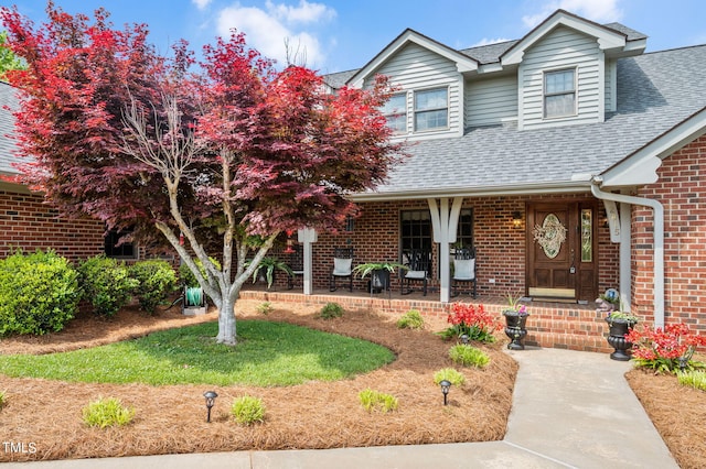 view of front of property featuring covered porch