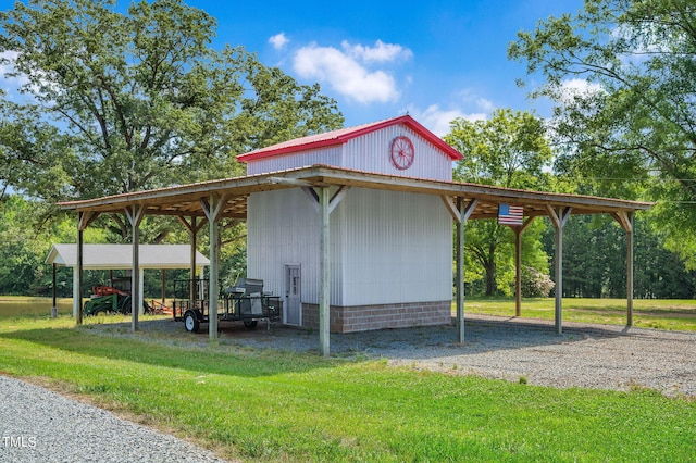 exterior space with a yard and a carport