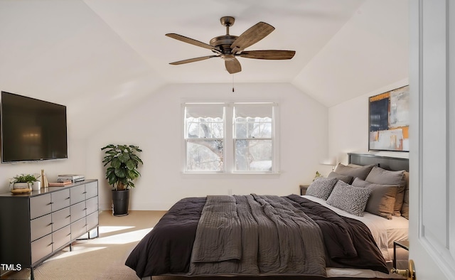 carpeted bedroom with lofted ceiling and ceiling fan