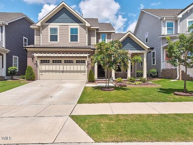 view of front of home with a garage and a front lawn