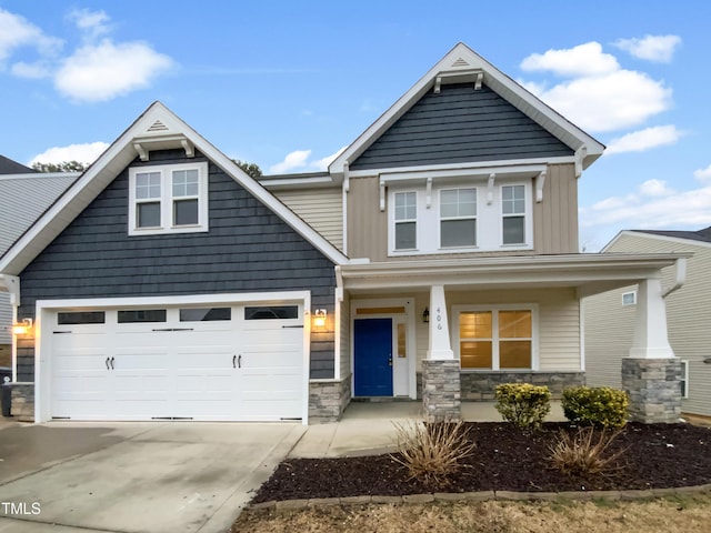 craftsman-style house featuring a porch and a garage