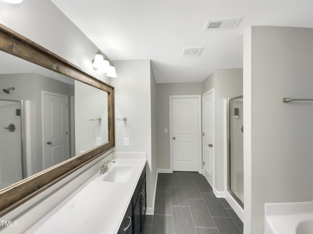 bathroom with independent shower and bath and vanity