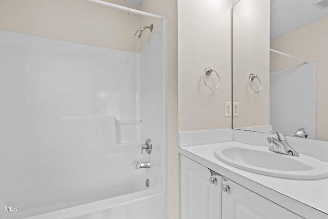 bathroom featuring vanity and shower / bath combination