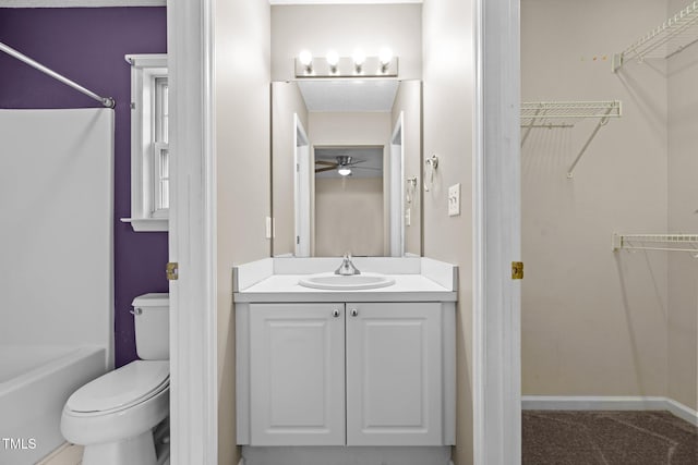 bathroom featuring vanity, ceiling fan, and toilet