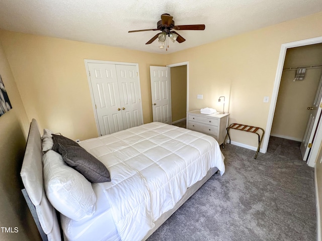 carpeted bedroom with a ceiling fan, a textured ceiling, baseboards, and a closet