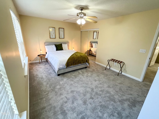 bedroom featuring ceiling fan, a closet, baseboards, and carpet flooring