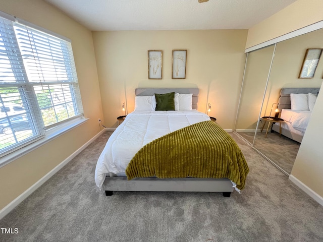 carpeted bedroom with a closet