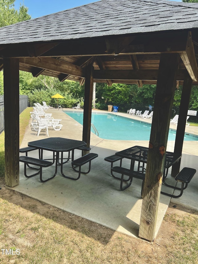 view of swimming pool with a gazebo and a patio