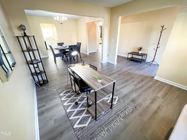 interior space featuring wood-type flooring and a chandelier