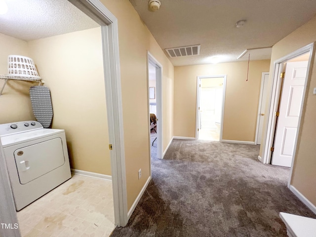 laundry area featuring washer / clothes dryer, visible vents, attic access, laundry area, and baseboards