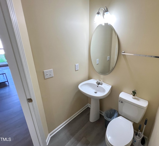 bathroom with wood-type flooring and toilet