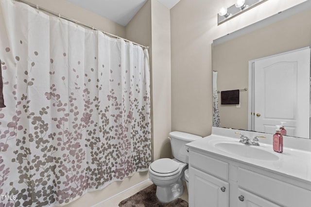 bathroom featuring vanity and toilet