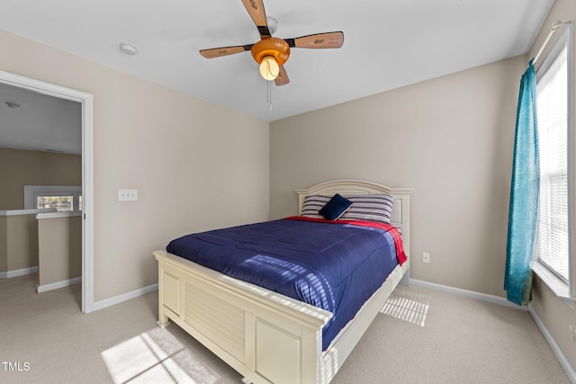 bedroom with light carpet and ceiling fan