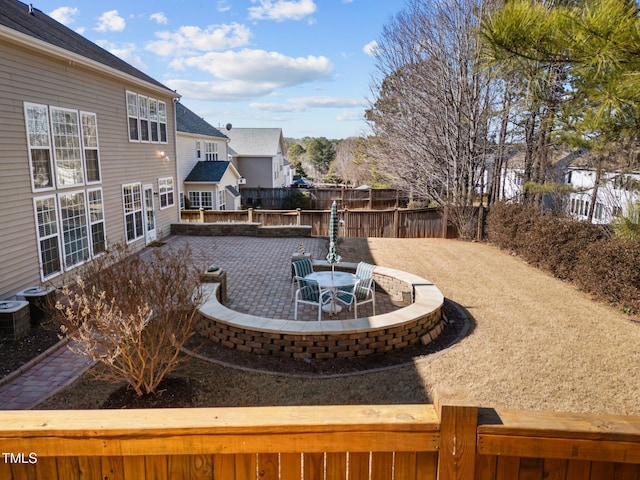 view of yard with central AC unit and a patio