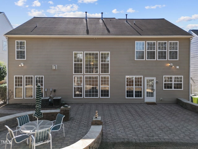 back of property with a patio area