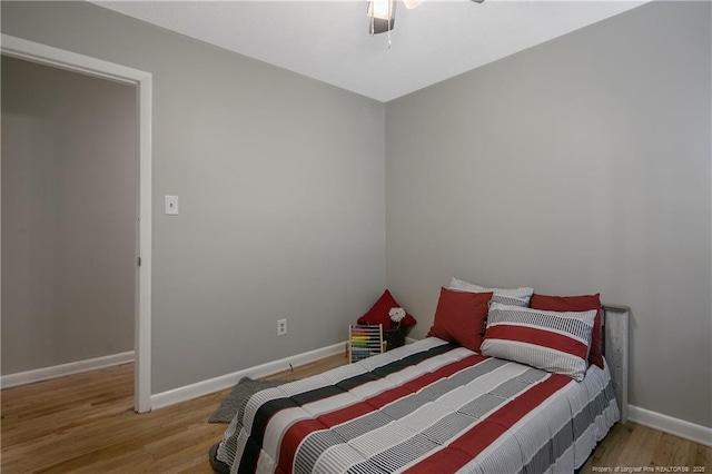 bedroom featuring light hardwood / wood-style flooring and ceiling fan