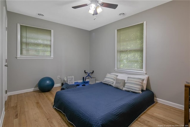 bedroom featuring light hardwood / wood-style flooring and ceiling fan