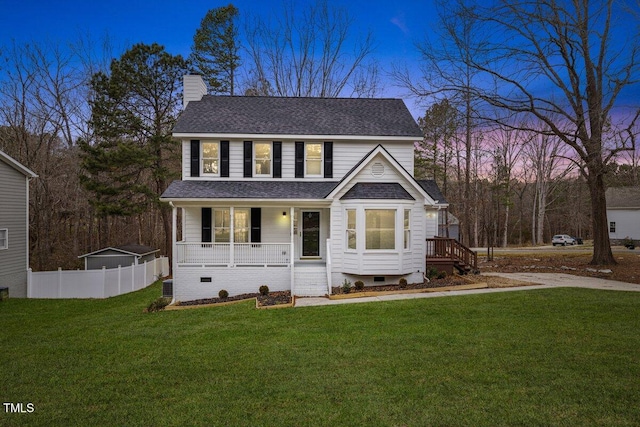 view of front facade featuring a yard and a porch